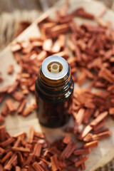 Red sandalwood oil in a glass bottle