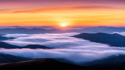 Obraz premium A breathtaking view of mountains blanketed by clouds at sunrise, showcasing vibrant colors in the sky, This image can be perfect for travel blogs, nature websites, or inspirational content,