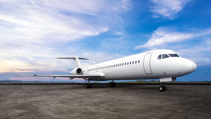 Commercial airplane on the runway with a blue sky background