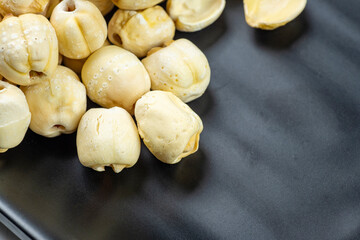 Closeup view of lotus seeds (Nelumbo nucifera) in the bowl