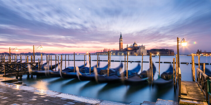 Gondolas at sunrise in St mark's basin, Venice, Italy