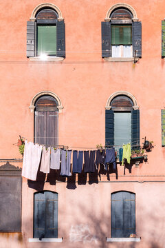 Facade of typical house with clothes hanging, Murano, Venice, italy