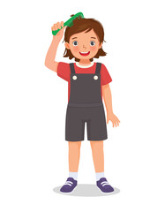 cute little girl combing her hair with comb