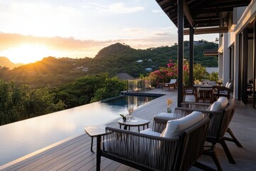 Fototapeta premium An enchanting sunset view from a modern luxury villa, showcasing serene landscapes and a tranquil infinity pool, perfect for relaxation and reflection in nature's beauty.