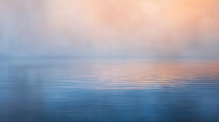 Obraz premium A serene view of calm water reflecting soft colors of sunrise.