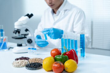 Scientist check chemical food residues in laboratory. Control experts inspect quality of fruits,...