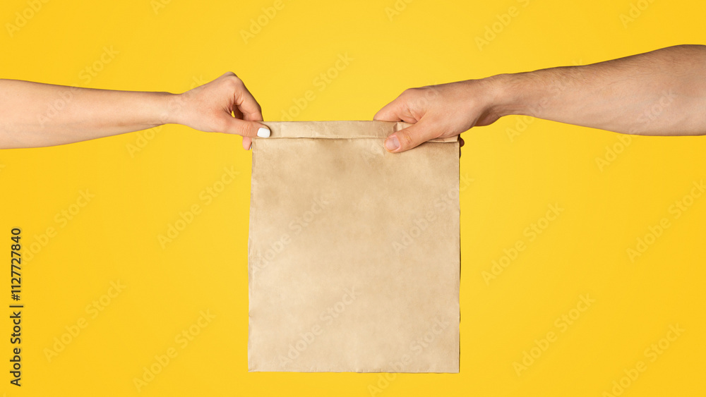 Poster takeaway food concept. delivery man giving paper bag with empty space for design to client, orange b