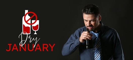 Mature man drinking alcohol on dark background. Banner for Dry January