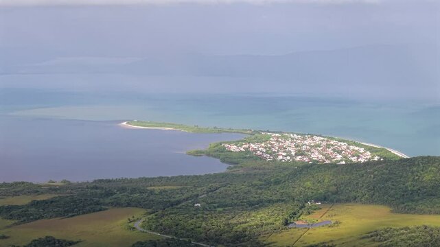 Distant drone view of Daniela Beach on a cloudy day, Florian&oacute;polis, Santa Catarina, Brazil.