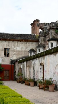 Traditional colonial building in Antigua Guatemala. Still shot. Vertical shot.