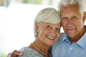 Hug, portrait and senior couple with love, care and happy marriage in retirement together in home space. Embrace, elderly man and old woman in house with smile, support and comfort in morning bonding