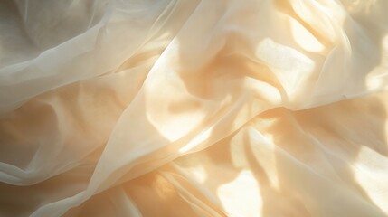 Obraz premium A close-up of soft cream fabric with gentle folds and light reflections.