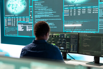 Cyber investigation team working in a governmental hacking room, working on computer security and...