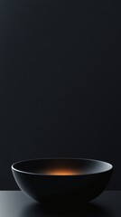 Elegant black bowl with soft lighting minimalist home decor modern aesthetic studio view