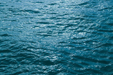 Background of sea water surface. Abstract blue sea water. Background texture. Water in swimming...