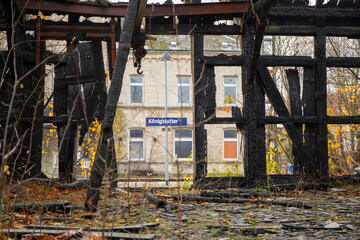 Old abandoned freight yard building with burn marks and vandalism