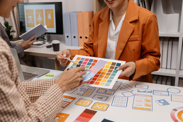 ux developer and ui designer brainstorming about mobile app interface wireframe design in the...
