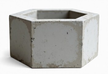 Hexagonal concrete planter box stands isolated against white backdrop. Durable modern design. Suitable for plants. Unique textured concrete look. Simple geometric shape. Minimalist style. Pot for