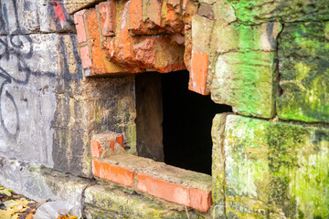 Old abandoned freight yard building with burn marks and vandalism