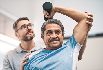 Physiotherapist, senior man and dumbbells for health, workout or sport in wellness, fitness and gym. Male people, exercise and care as physiotherapy, active and rehabilitation clinic for consultation