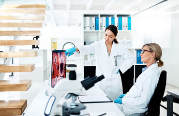 Medical research, scientist and women in lab, collaboration and colleagues with project, healthcare or teamwork. Computer, online and ideas for cure, screen and vaccine for Oropouche virus or science