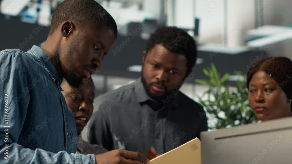 Aufkleber african american team collaborates on a financial planning project in a business space, emphasizing 