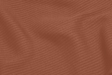 Mocha Mousse toned colour monochrome texture knitted fabric. Knitted Jersey as textile background. Monochrome color background. Wool knitting texture. Trendy color 2025.