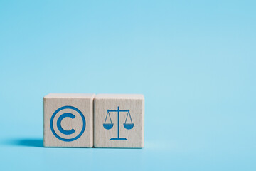 Copyright or patent concept. Copyright icon on wooden block for author rights and patent intellectual property