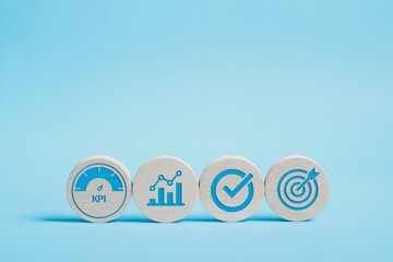 KPI, business performance indicators, Data management system icon on wooden block to make report...