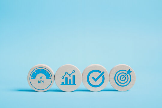 KPI, business performance indicators, Data management system icon on wooden block to make report with KPI, metrics connected to database. finance, operations, sales, marketing.