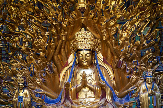 ancient thousand-armed Bodhisattva in temple in Dazu, Chongqing, China