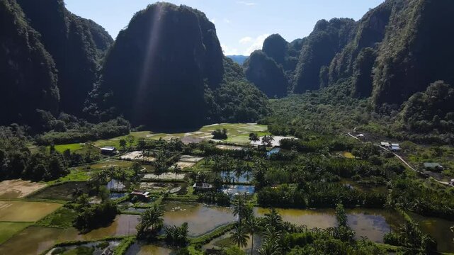 Rammang-Rammang Karst Village, Sulawesi, Indonesia - A Village Surrounded by Towering Limestone Cliffs and Unique Karst Formation - Drone Flying Forward