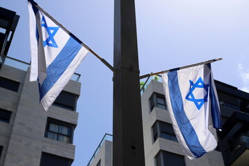 Naklejka premium White and blue flag of Israel with the Star of David.