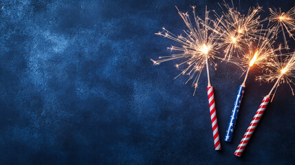 sparkler fireworks on blue background for 4th of july independence day celebration
