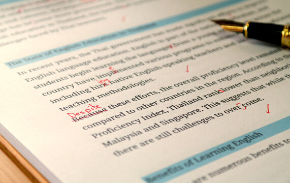 English article being proofread in office