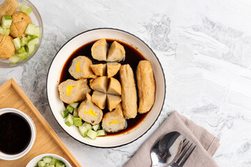 Pempek or Indonesian fish cake. Made from fish and flour. served with cuko. originated from palembang, sumatera. Perfect for recipe, article, catalogue, photo illustration, or any commercial purposes.