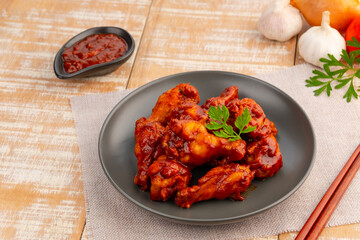 New orleans Marinated chicken wing stick on black plate.sweet and spicy.