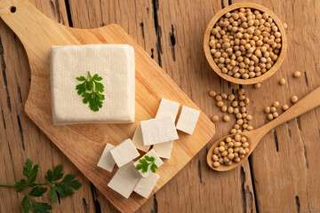 Sliced block tofu,Hard white Tofu soy bean curd on a wooden plate.Top view with copy space.