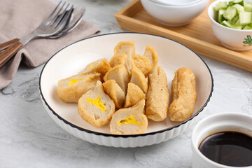 Pempek or Indonesian fish cake. Made from fish and flour. served with cuko. originated from palembang, sumatera. Perfect for recipe, article, catalogue, photo illustration, or any commercial purposes.