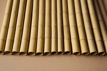 a close up of a bunch of bamboo sticks on a table