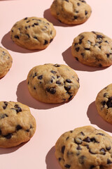 Chocolate soft cookies pattern on a pastel color background. Perfect for recipe, article, or any commercial purposes.