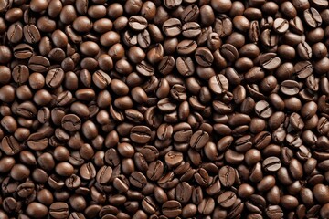 Fototapeta premium a close up of a pile of coffee beans with a lot of coffee beans