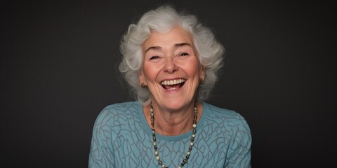 An uplifting image of a joyful senior woman with curly white hair laughing heartily, showcasing the beauty and positivity of aging with grace and humor.