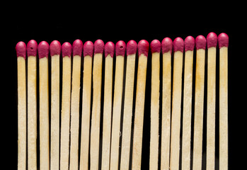 Wooden matches on a black background