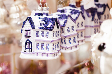 Close-up of a Christmas house toy on a blurred background