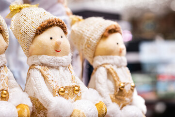 Close-up of Christmas Toy of Boy, Girl on blurred background