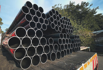 Construction products on transport vehicles Group of steel pipes for industrial materials...