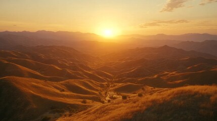 Fototapeta premium Golden Sunset Over Rolling Mountain Ranges