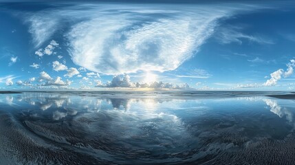 Serene Coastal Landscape with Cloud Reflections and Blue Sky