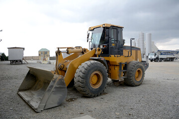 A pile of coal ore with a front end loader